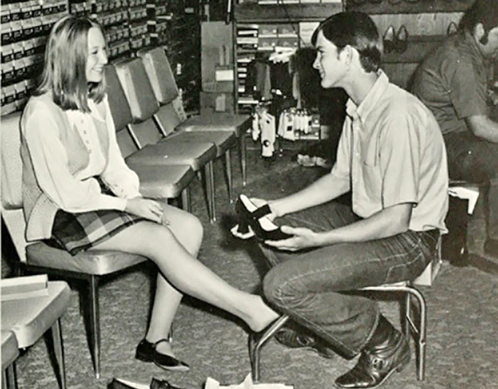 vintage boy and girl at shoe store