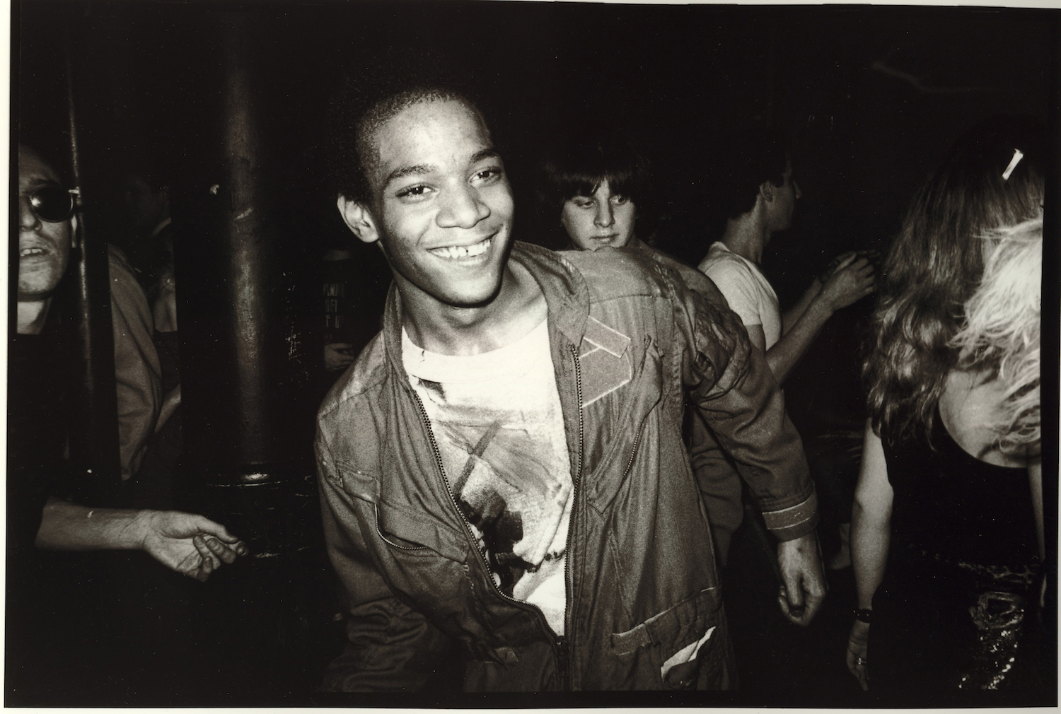Jean-Michel Basquiat dancing at the Mudd Club with painted t-shirt, 1979 Courtesy Nicholas Taylor