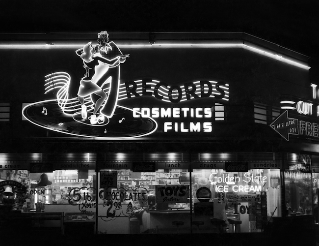 The neon sign advertising records and other items for sale at Russ Solomon’s father’s Sacramento drugstore. (Image courtesy Gravitas Ventures)