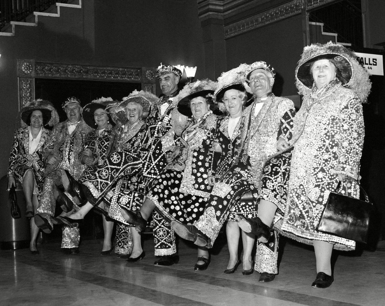 Pearly Kings and Queen from London Boroughs do the 'Knees up Mother Brown' dance when they attended the premiere of the film 'Up The Junction' at the Granada, Clapham Junction, London on London Pearly Kings And Queen, London