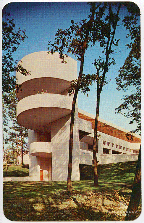 After a fire destroyed the main building at this resort in the Poconos, a replacement went up in the early 70's. It is a truly striking sight, a modernist spaceship tucked away deep in the woods. (Photograph by Pablo Iglesias Maurer, postcard by Kardmasters)
