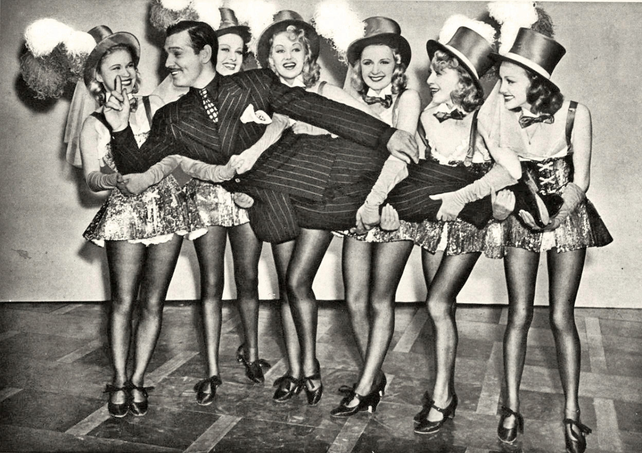 Clark-Gable-with-chorus-girls.jpg