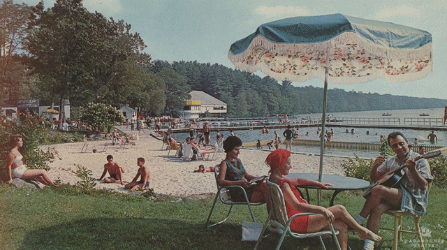 Sunbathing and swimming in the Poconos. Postmarked, 1967. "Dear Jonnie: If you were only here, I would take you out for a horse-back ride - or else we could go golfing. Be good until I see you. Dr. Waterman." (Photograph by Pablo Iglesias Maurer, postcard published by Kardmaster Brochures.)