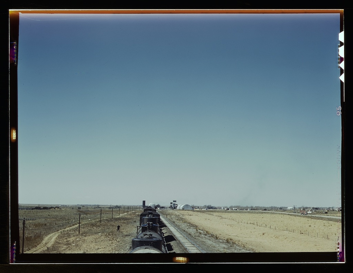Westbound freight train stopping for water, Melrose, N[ew] Mex[ico] 1 transparency : color. Contributor: Delano, Jack Date: 1939