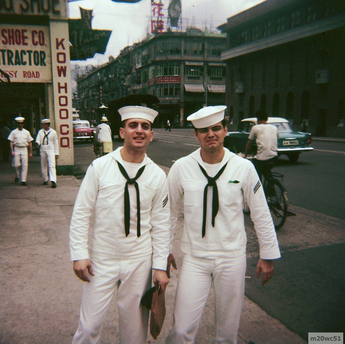 Sailors in Wanchai,1961 They would seem to be on Hennessy Road. That distinctive building on the right should pinpoint the location. Anyone recognize it? My 1960 guide book states that the Kow Hoo Shoe Co. was at 19-21 Hennessy Road. The sign for the 'Union Bar' can be seen. It was at 23 Hennessy Road.