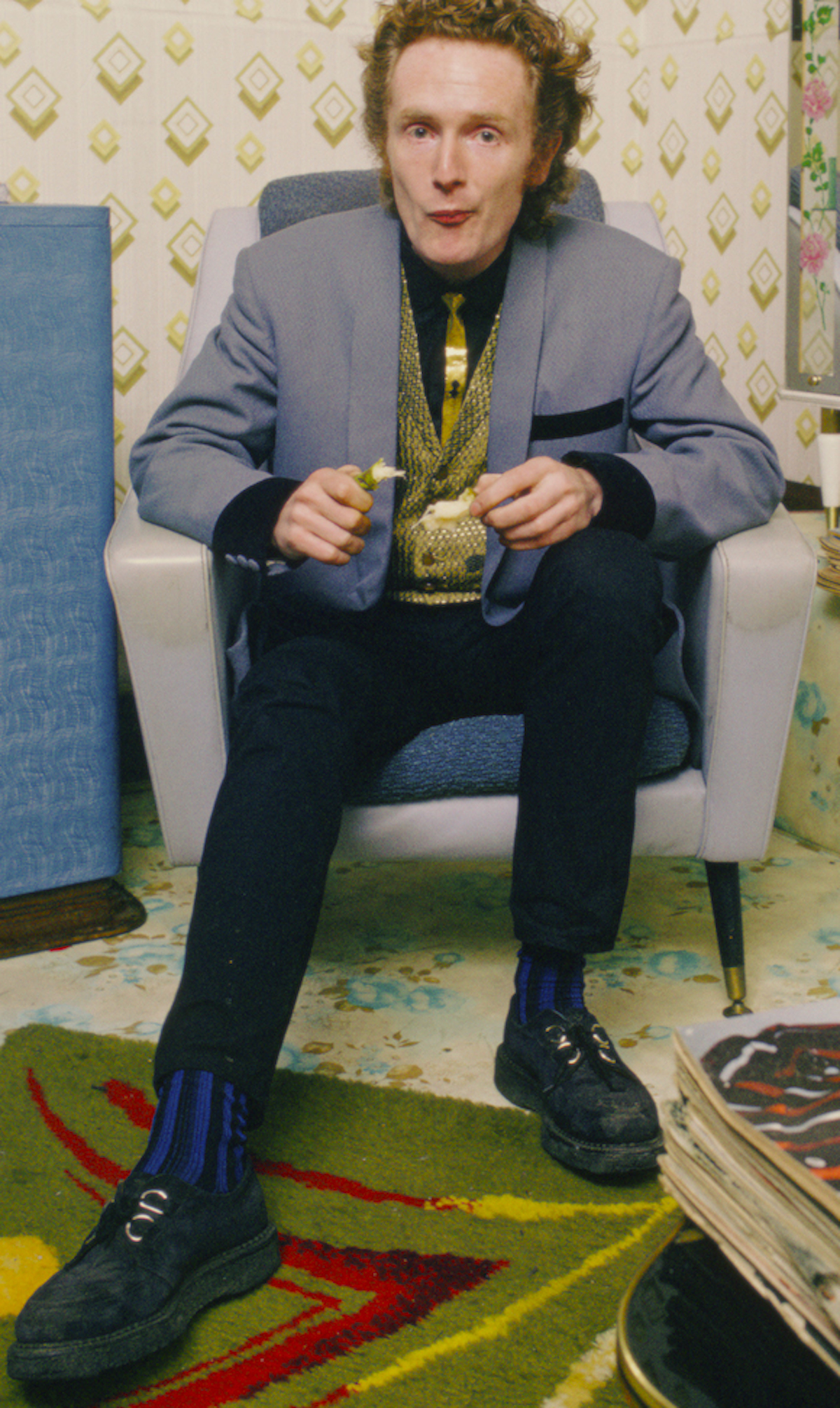 Malcolm McLaren in a previously unpublished shot wearing original 50s George Cox Bingley D-ring brothel creepers to match his detail-perfect Teddy Boy garb. Photo taken inside Let It Rock, 430 King’s Road, January 1972. (c) David Parkinson