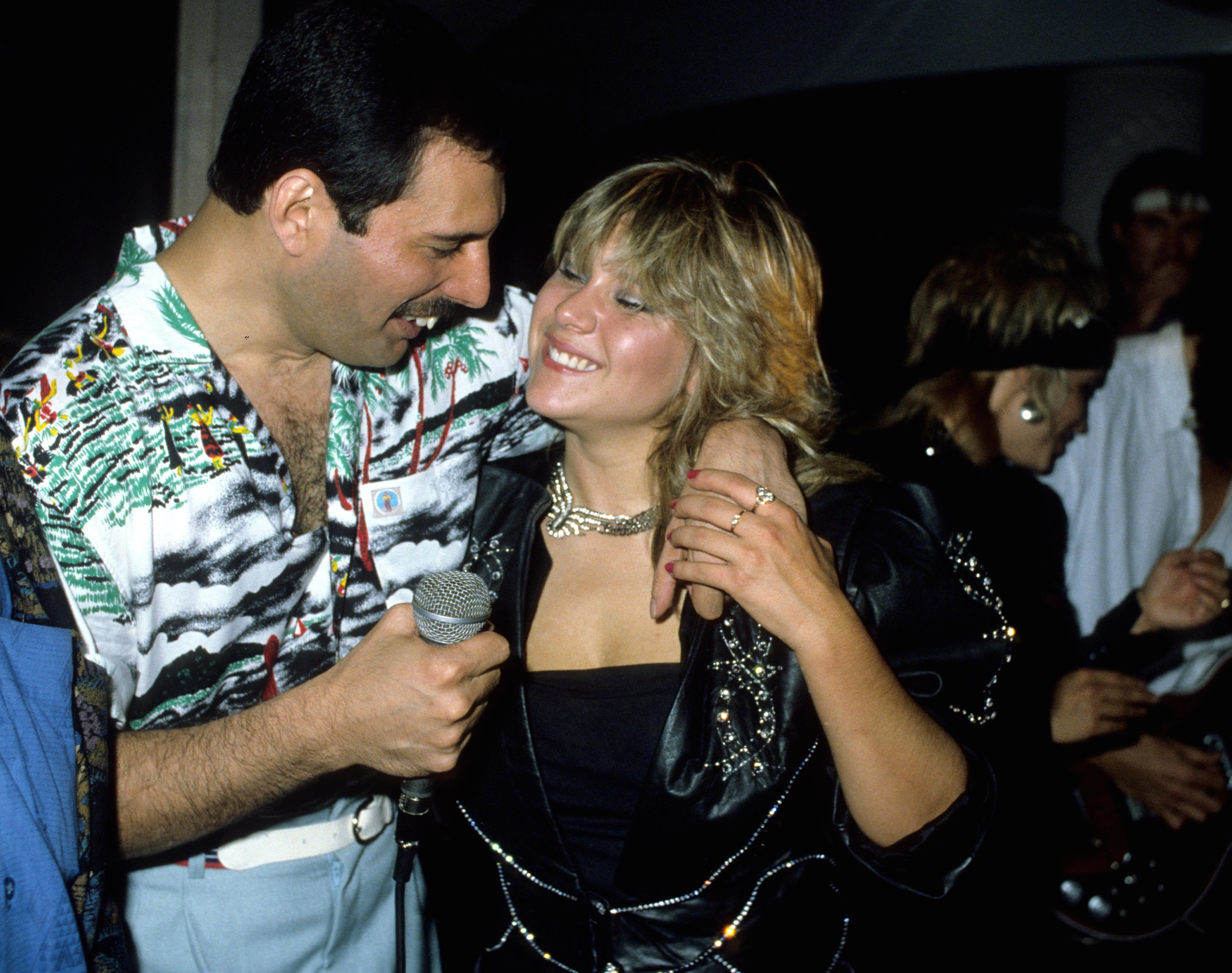 Mandatory Credit: Photo by Alan Davidson/Silverhub/REX/Shutterstock (7544916d) Queen Hold A Private Concert and Party and Were Billed As 'Dicky Heart and the Pacemakers' at the Kensington Roof Gardens Freddie Mercury and Samantha Fox Queen Private Party and Concert - 11 Jul 1986
