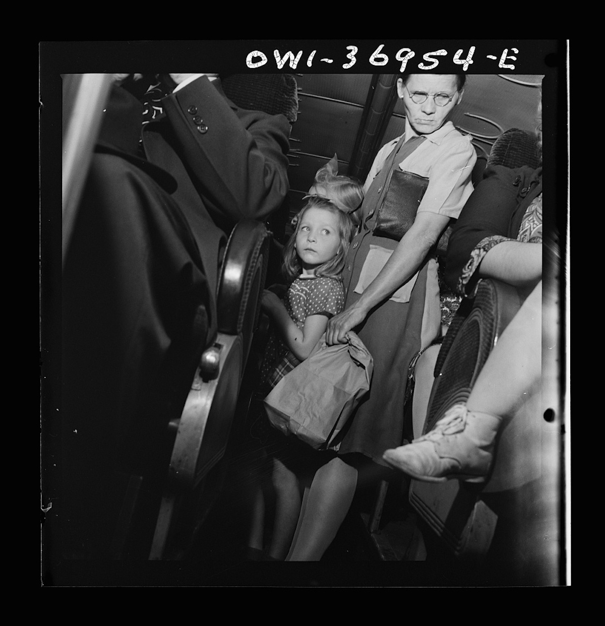 Passengers standing in the aisle of a Greyhound bus going from Washington, D.C. to Pittsburgh, Pennsylvania