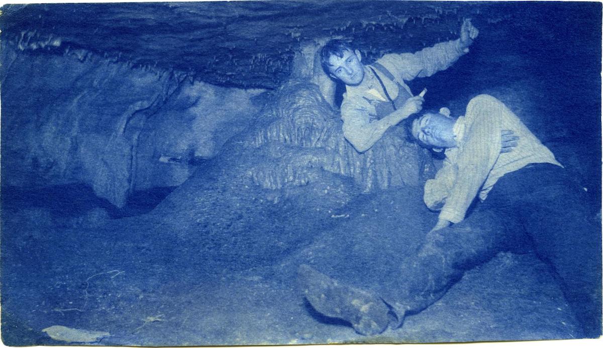 Cyanotype of two of Byrd Williams, Jr.'s friends exploring underground caverns in and around Austin. DATE: 1903 CREATOR: Williams, Byrd M. (Byrd Moore), Jr.