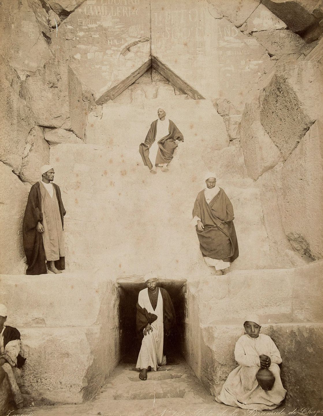 Men at the entrance to the Great Pyramid of Giza.