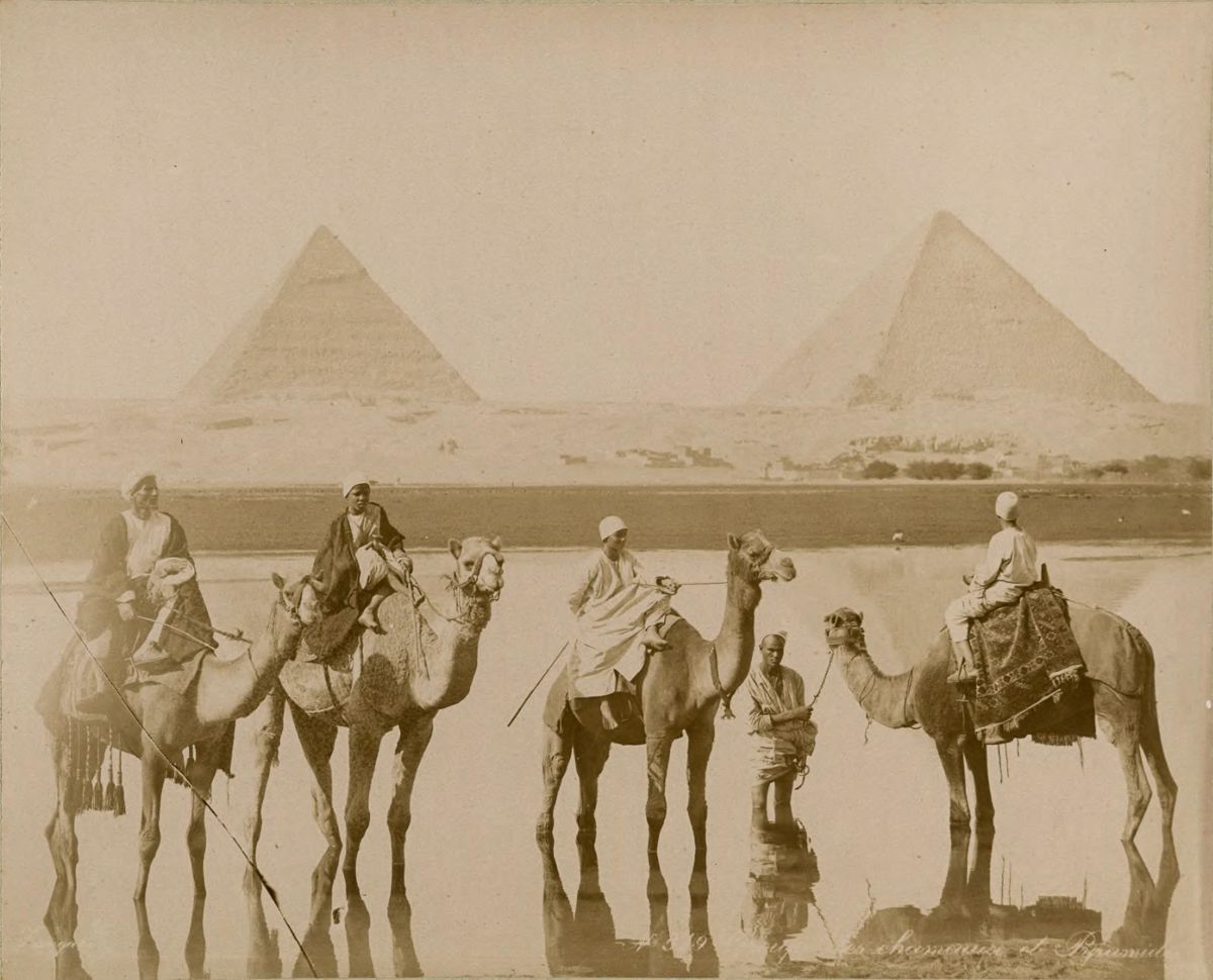 Camel riders near the pyramids.