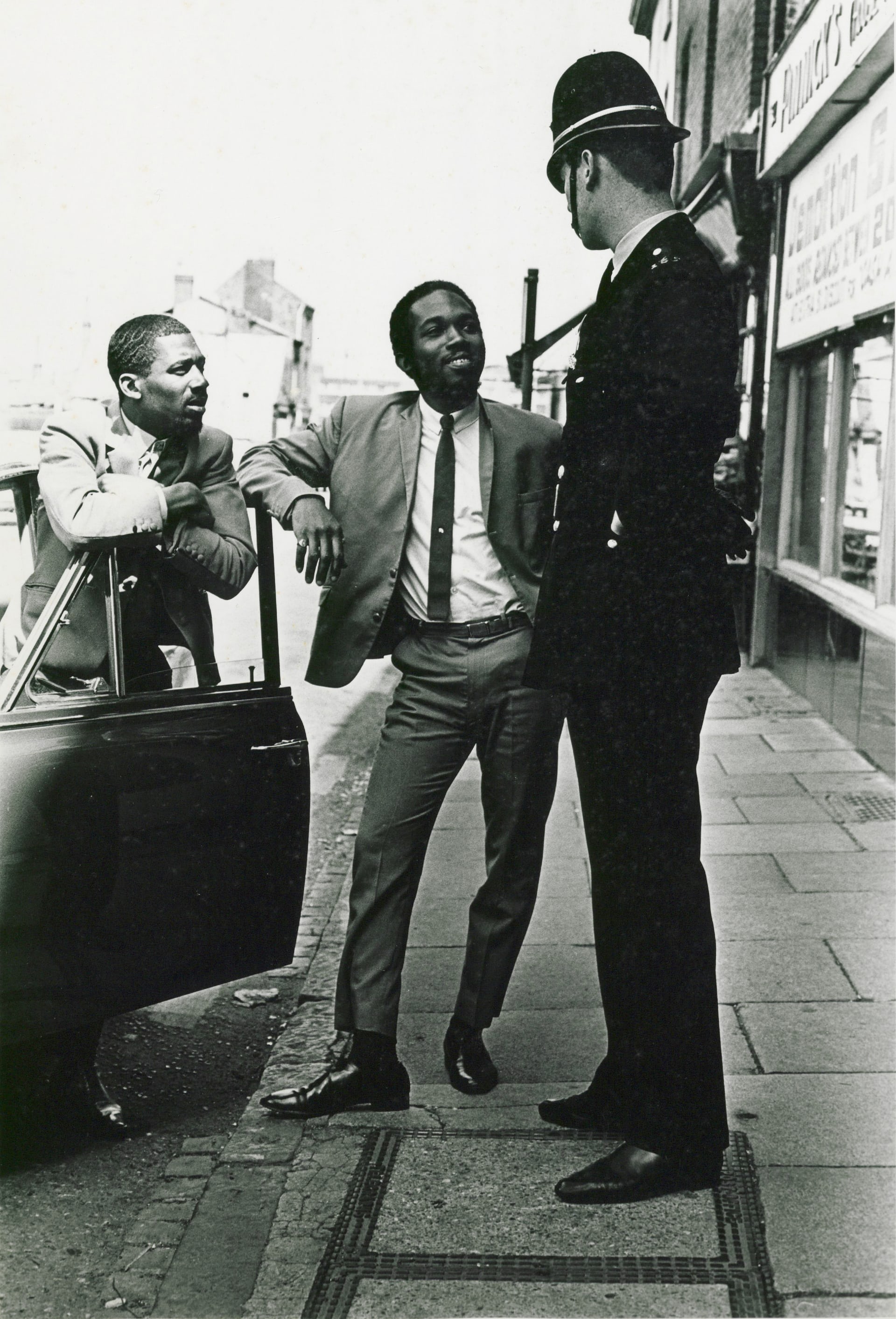 Pimps and a cop on the street (c.1968), by Janet Mendelsohn