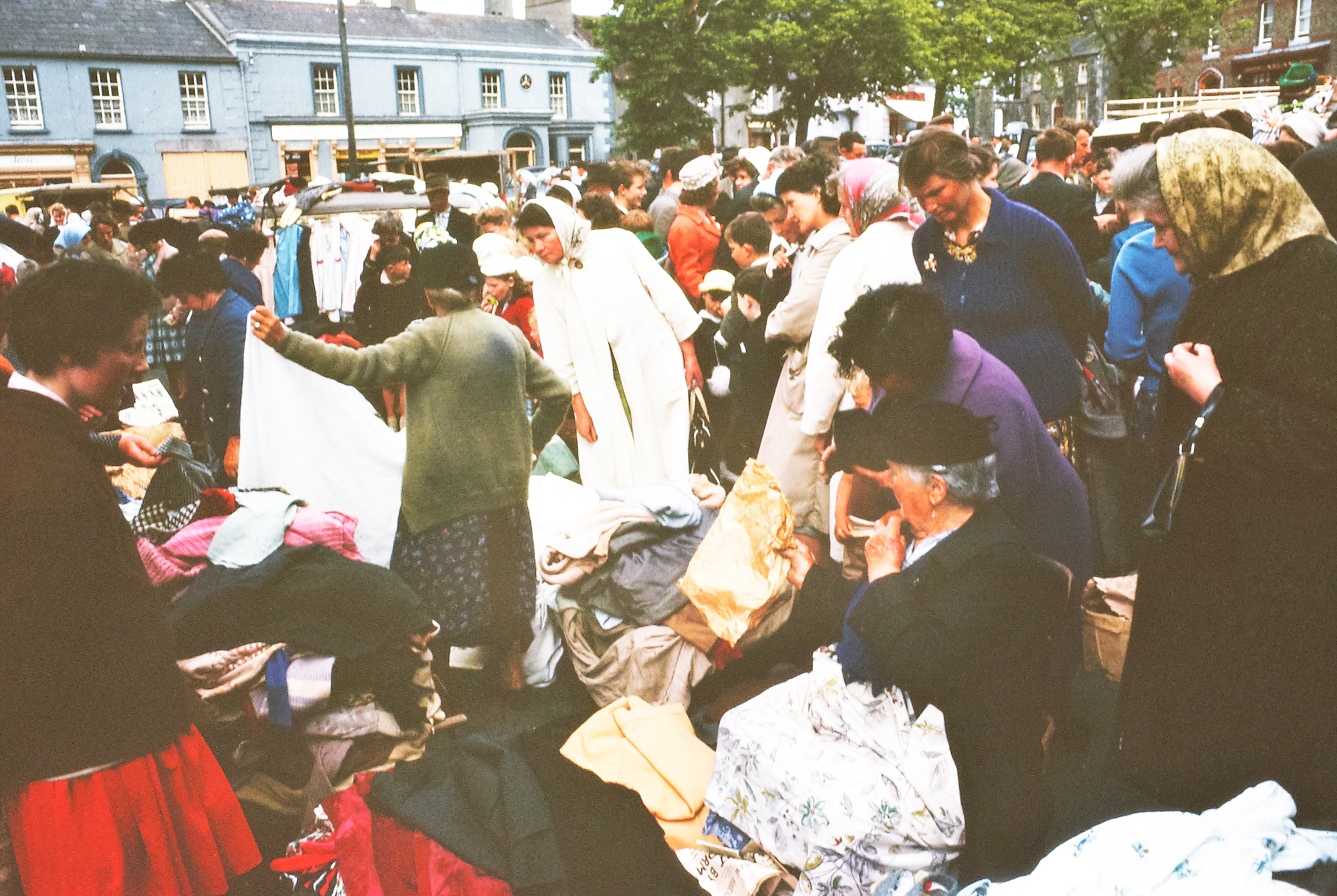 Ireland 1960s, Clothes Market, but where? Kildare Town! Asked if this Square dislodged any memories for you, because we didn't know where photographer Richard Tilbrook took this one... DannyM8 identified it in jig time as Kildare Town! Date: June 1963