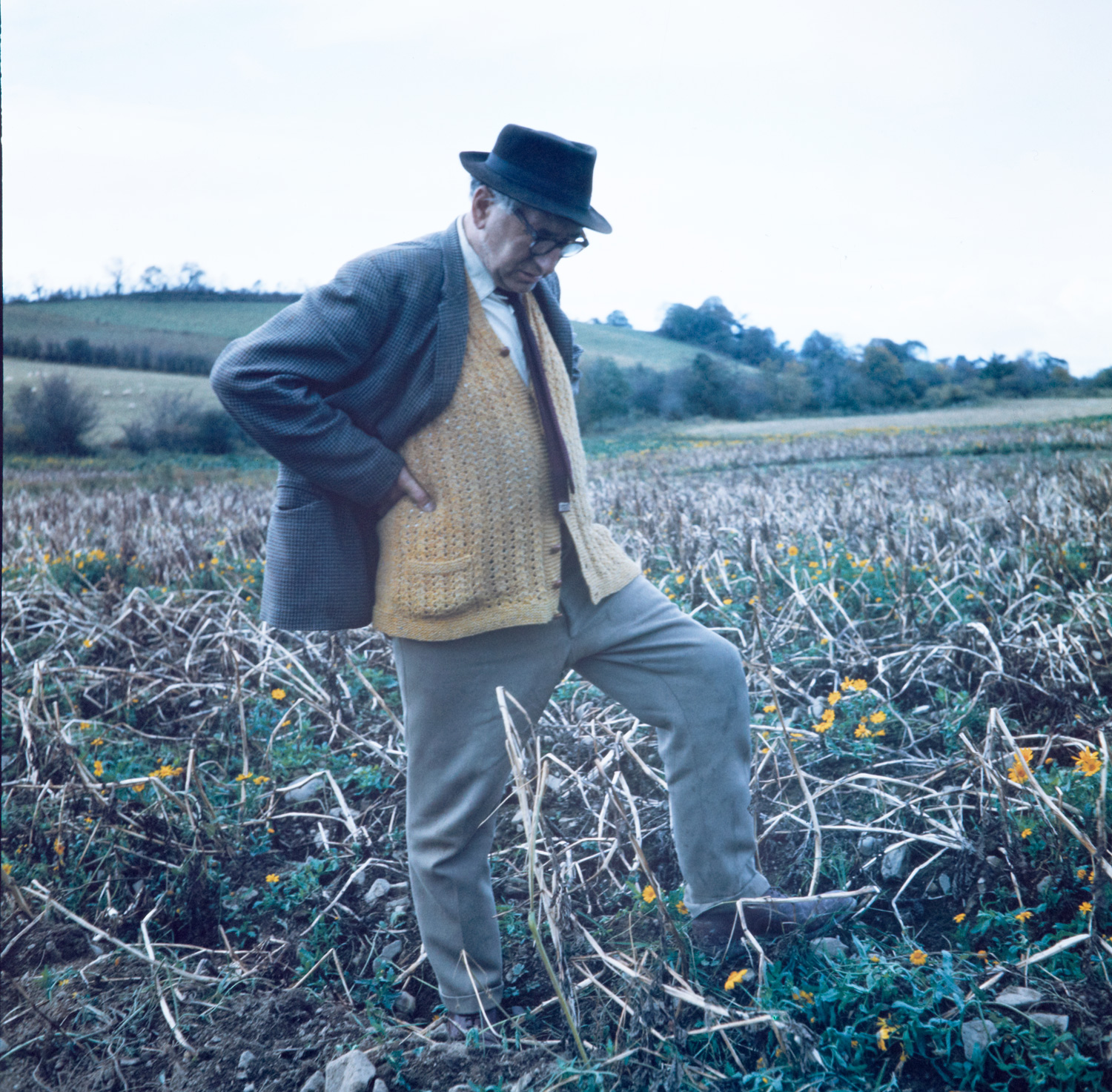 Ireland 1960s , Poet Patrick Kavanagh… … pondering the Stony Grey Soil of Monaghan at his native Inniskeen. The Dictionary of Irish Biography entry for Patrick Kavanagh gives 21 or 23 October 1904 as his birth date, but most other sources say that Patrick Kavanagh was born on 21 October, which is 109 years ago today. Photographer: Elinor Wiltshire Date: 1963