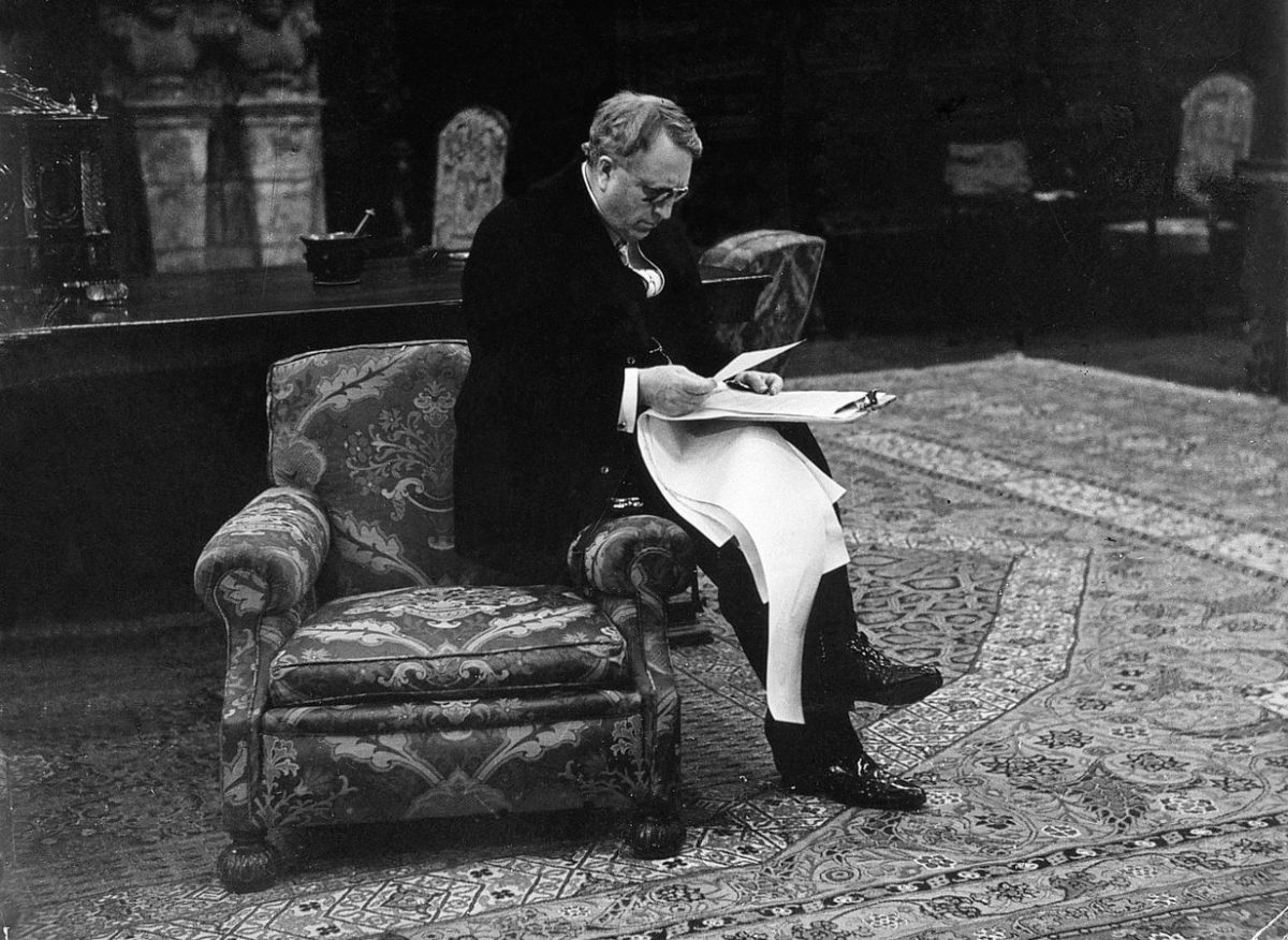 The publisher William Randolph Hearst reading dispatches in his California home, "La Cuesta Encantada". San Simeon, 1930.