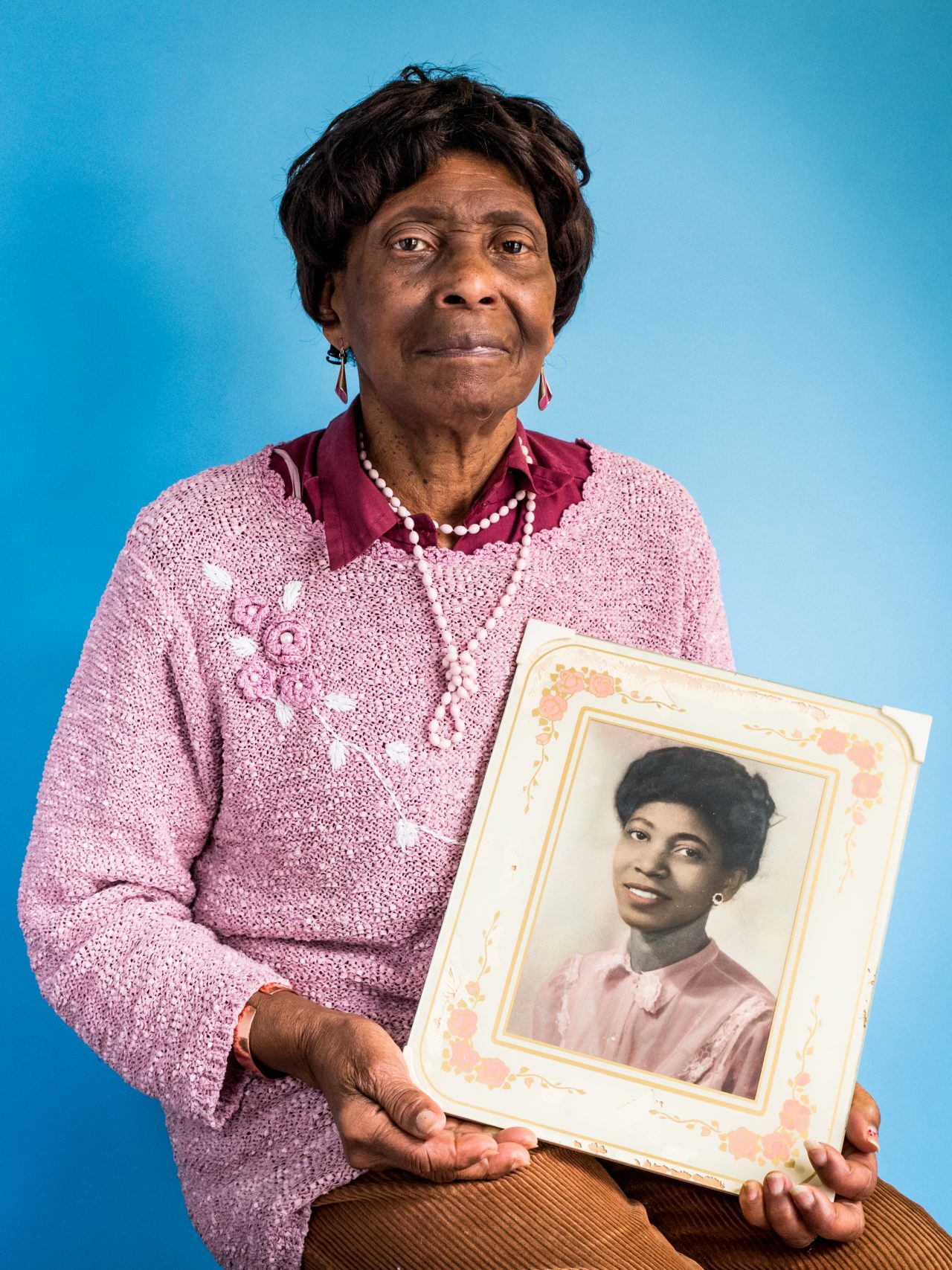 Rose was born in Jamaica in 1932. She arrived in London in 1956; the portrait she holds was taken in Jamaica just before she left. Now aged 86, Rose has 3 children; 4 grand-children; and one great grand-child.