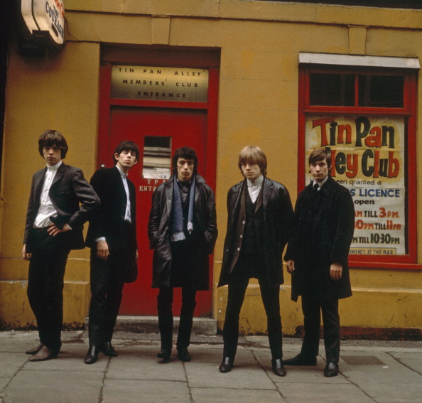 The Rolling Stones line up outside the Tin Pan Alley Club in London, 1963. From left to right, Mick Jagger, Keith Richards, Bill Wyman, Brian Jones (1942 - 1969) and Charlie Watts. (Photo by Terry O'Neill/Hulton Archive/Getty Images)