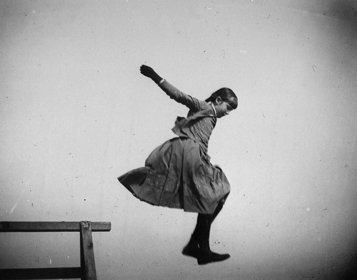 June 11, 1886 Ethel Merritt jumps in the air at Coney Island.