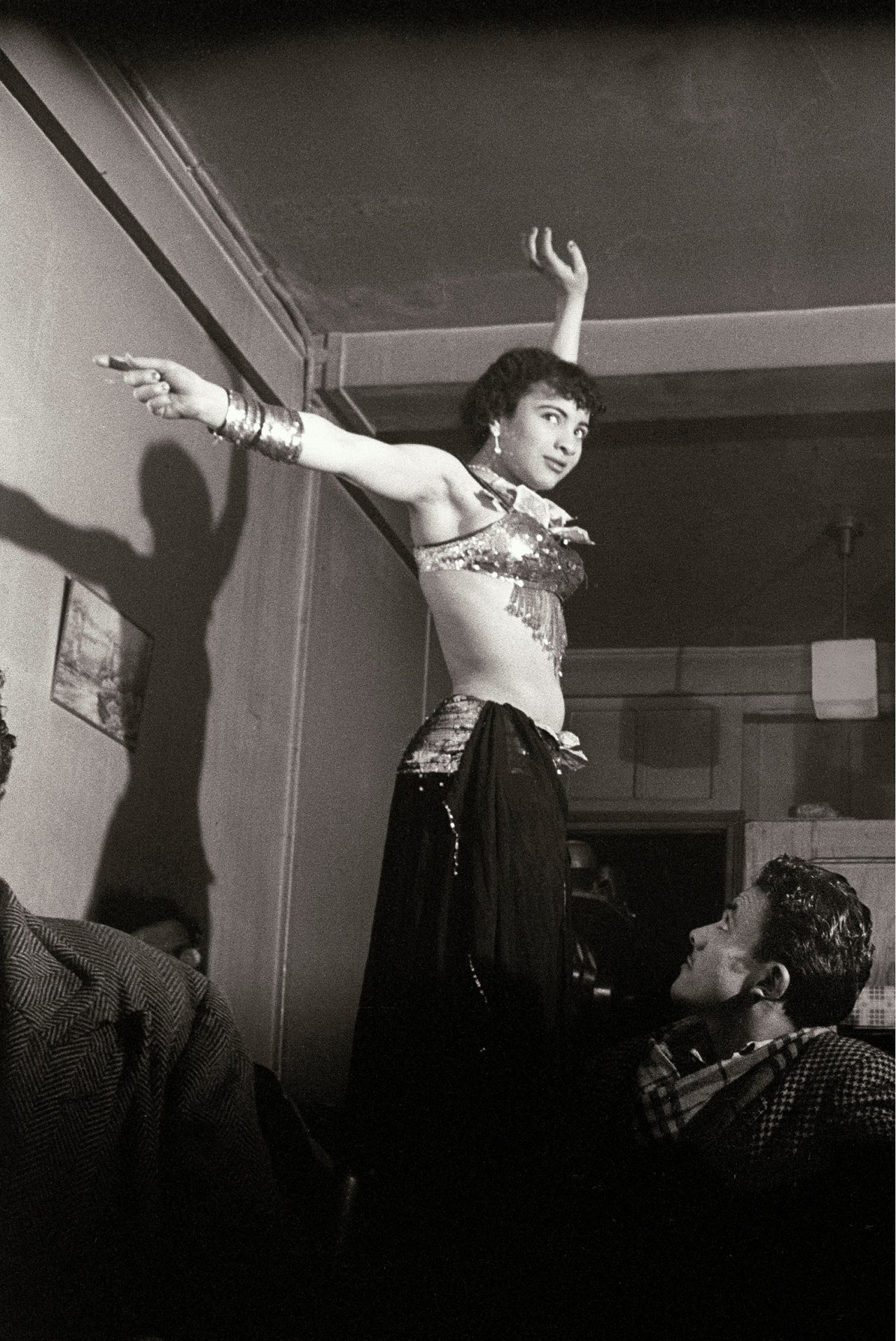 A Kabyle dancer in the district of Barbès, Paris, 1955 Photograph: © Pierre Boulat - Musée national de l'histoire de l'immigration, Palais de la Porte Dorée Paris