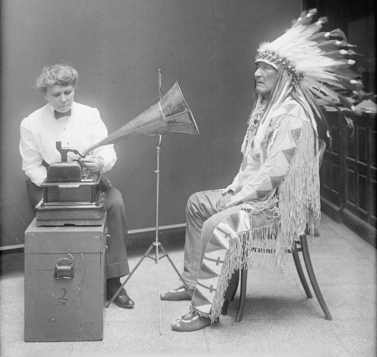 American anthropologist and ethnographer Frances Densmore records the Blackfoot chief Mountain Chief in 1916 for the Bureau of American Ethnology. Library of Congress.