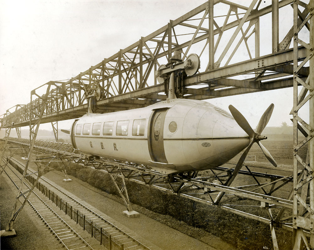 The propeller-driven Bennie Railplane, designed in 1930 by George Bennie, was a prototype that aimed to solve the problem of more economical and rapid transport via a high-speed monorail link from London to Paris. A short test track was built in Glasgow, Scotland, but the economic troubles of the ’30s doomed the project. The test track hung around, rusting and abandoned, through the 1950s.