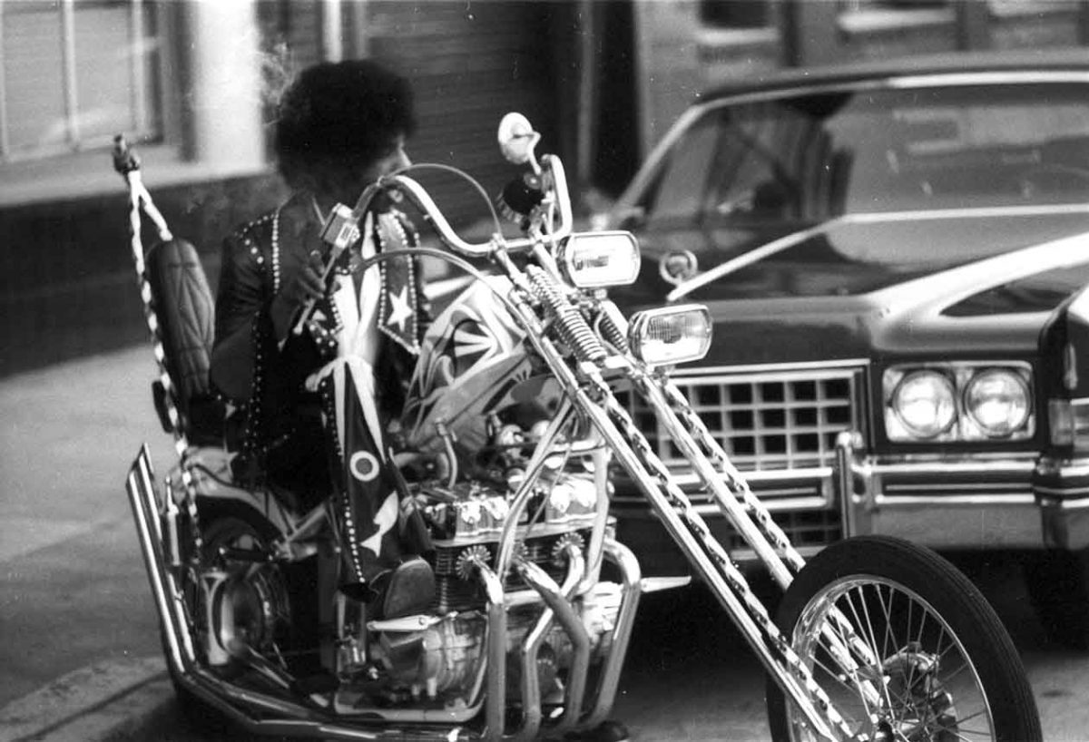 Sly Stone rides his chopper