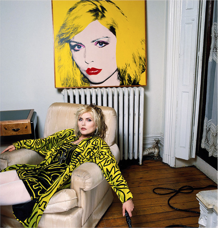 Brian Aris: Debbie Harry, New York Apartment with Warhol Portrait, 1988