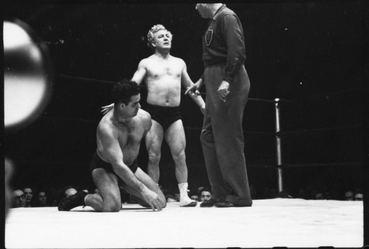 Craning and standing to see more of Gorgeous George at the Ampitheter, Chicago - 1949