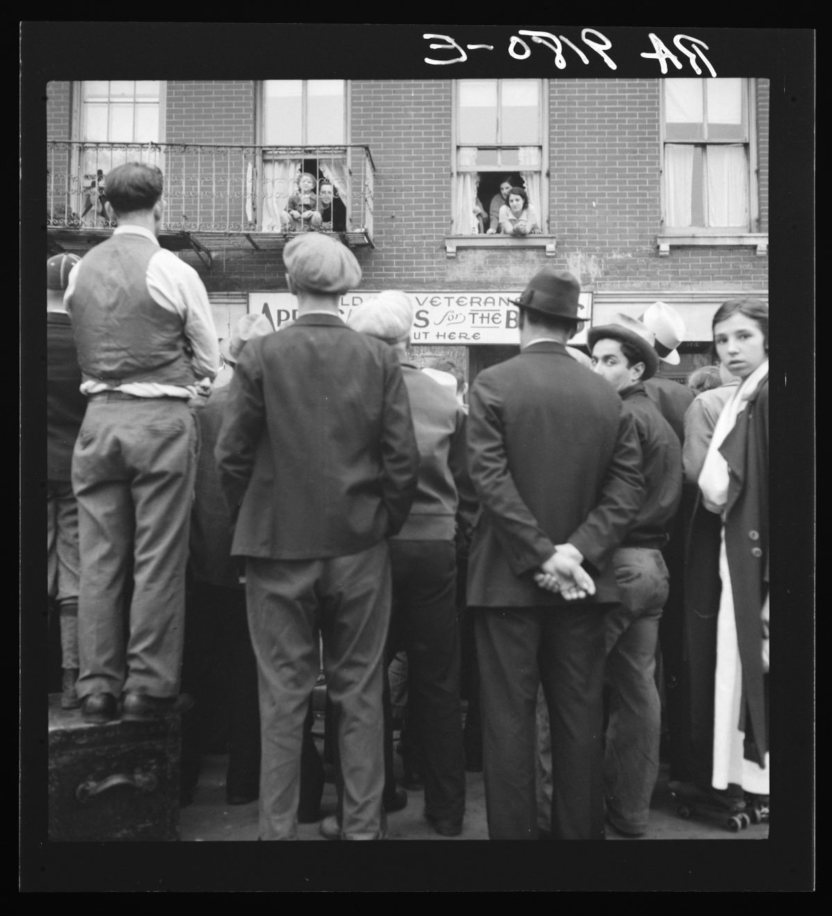Title: Crowds around post office. Lower East Side, New York Creator(s): Lange, Dorothea, photographer Date Created/Published: 1936 June.