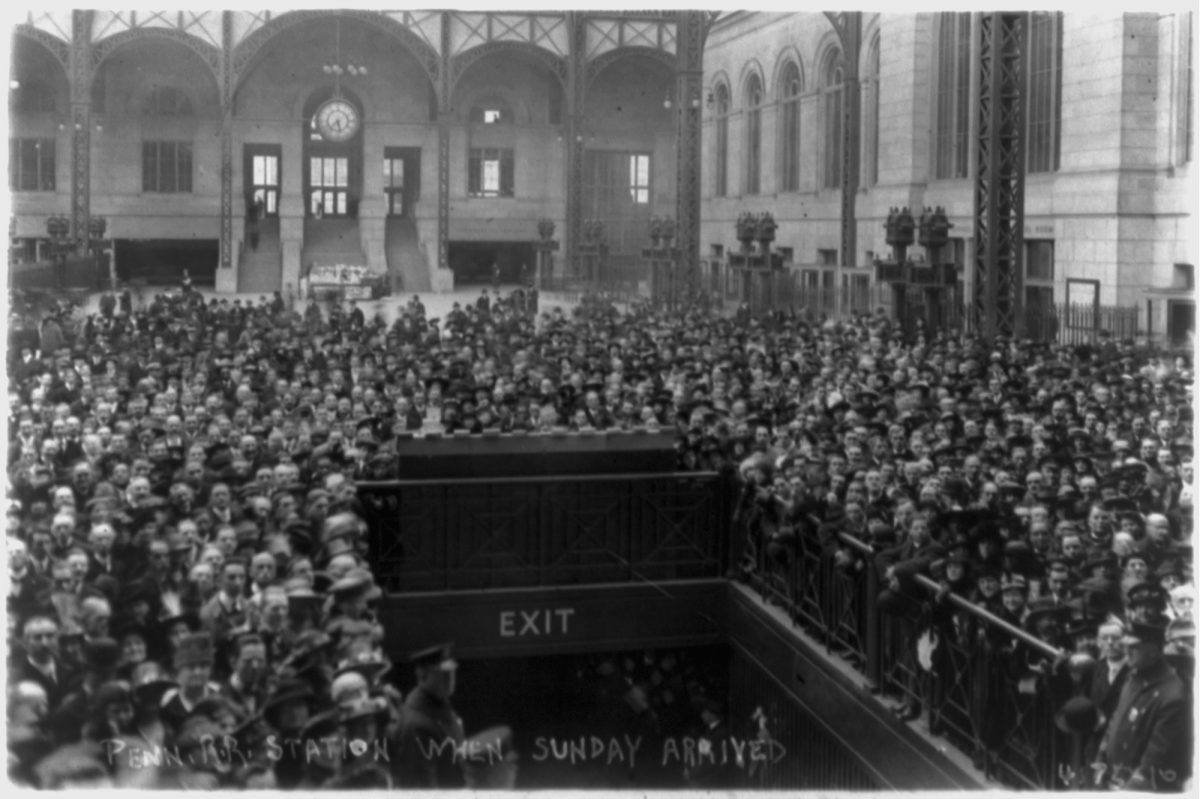 Title: Penn. R.R. Station when Sunday arrived Date Created/Published: [1917] Medium: 1 photographic print : gelatin silver. Summary: Crowd gathered around exit at Pennsylvania Station in New York City awaiting the arrival of Billy Sunday.