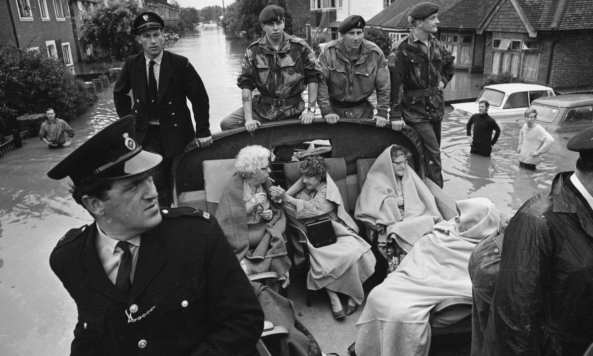 Patients from Molesey Cottage Hospital who were rescued by police and soldiers during flooding in Surrey, 17 August 1968