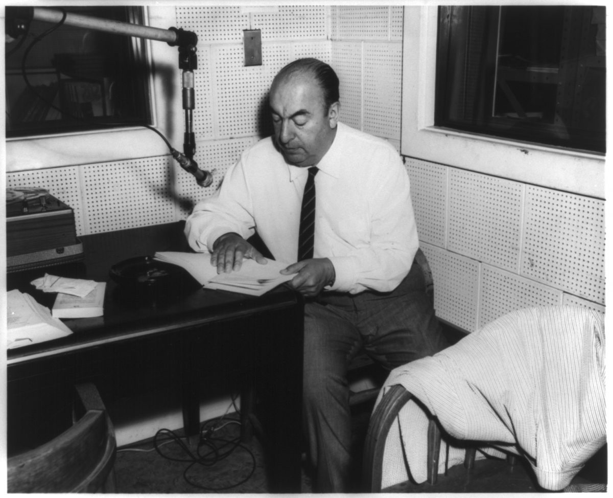 Photograph shows Chilean poet Pablo Neruda, seated at a table in front of a microphone in the Library of Congress Recording Laboratory, Studio B, Washington, D.C., during the recording of his poem "Alturas de Macchu Picchu" for the Archive of Hispanic Literature on Tape. Created / Published [Washington, D.C.], [20 June 1966]