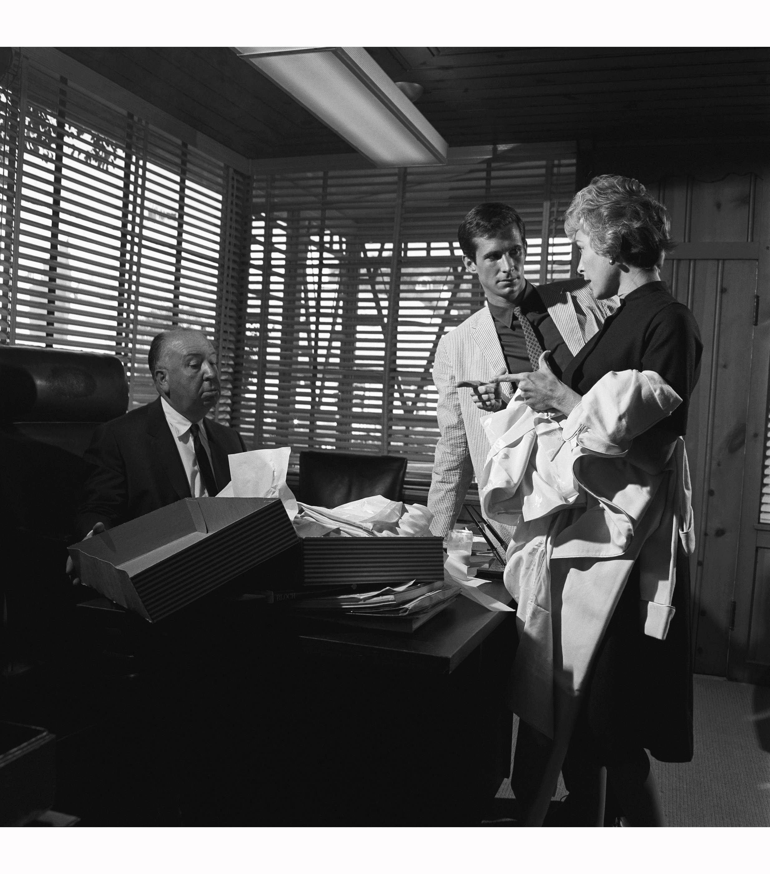 Anthony Perkins and Janet Leigh visit Alfred Hitchcock in his studio office  in advance of filming Psycho, 1959 © Sid Avery - Flashbak