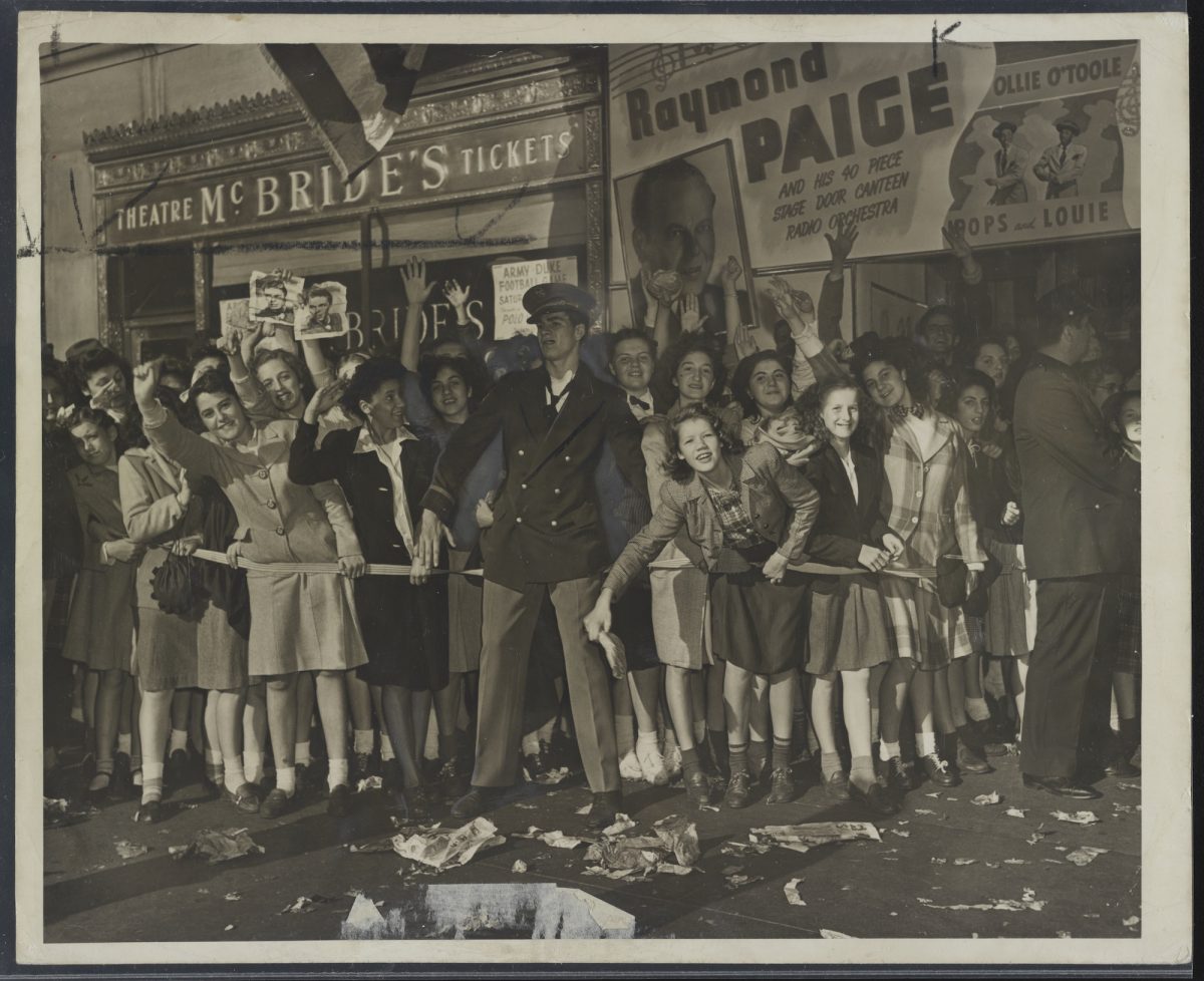 Female fans eagerly waiting to see Frank Sinatra] / World Telegram & Sun photo by Edward Lynch. Summary Photograph showing an enthusiastic crowd of young female fans, some waving pictures of Sinatra, being held back by a barrier rope and a theater usher outside the Paramount Theater. Contributor Names Lynch, Edward, photographer Created / Published [United States] : [1944 Oct 12]