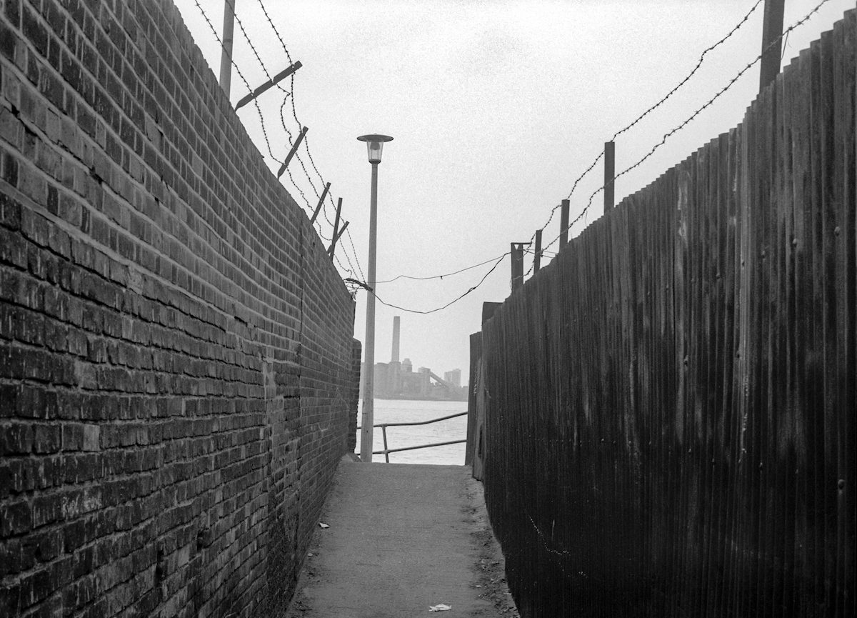 Riverside path, River Thames and view of Deptford Power Station, Greenwich. 1980