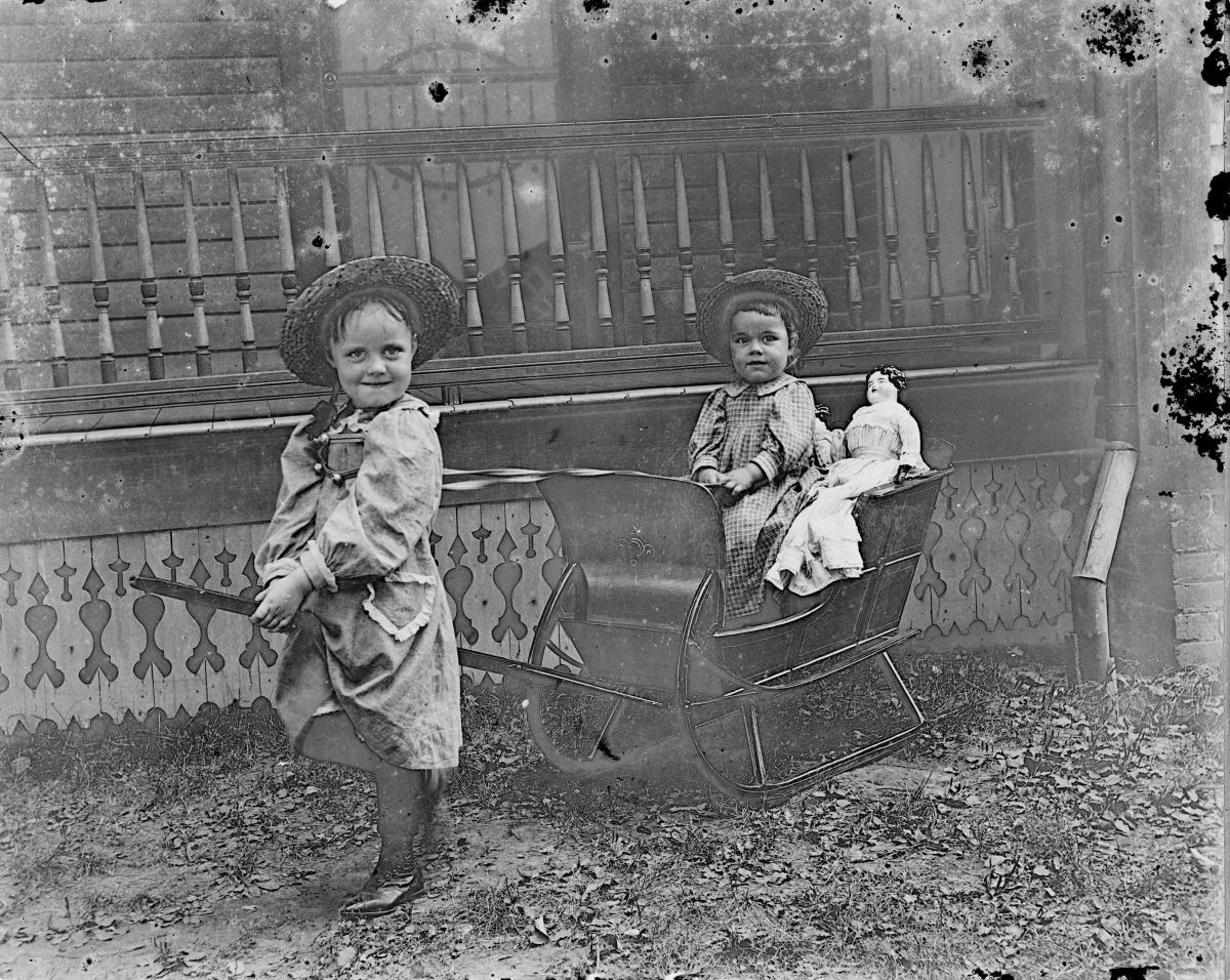 Girls playing outside with sled (2)George Silas Duntley Photographs 1899-1918