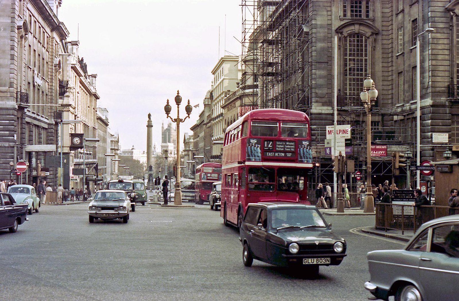 AEC Routemasters vie with other traffic at the junction of Lower Regent Street and Piccadilly Circus on 19th April 1975.