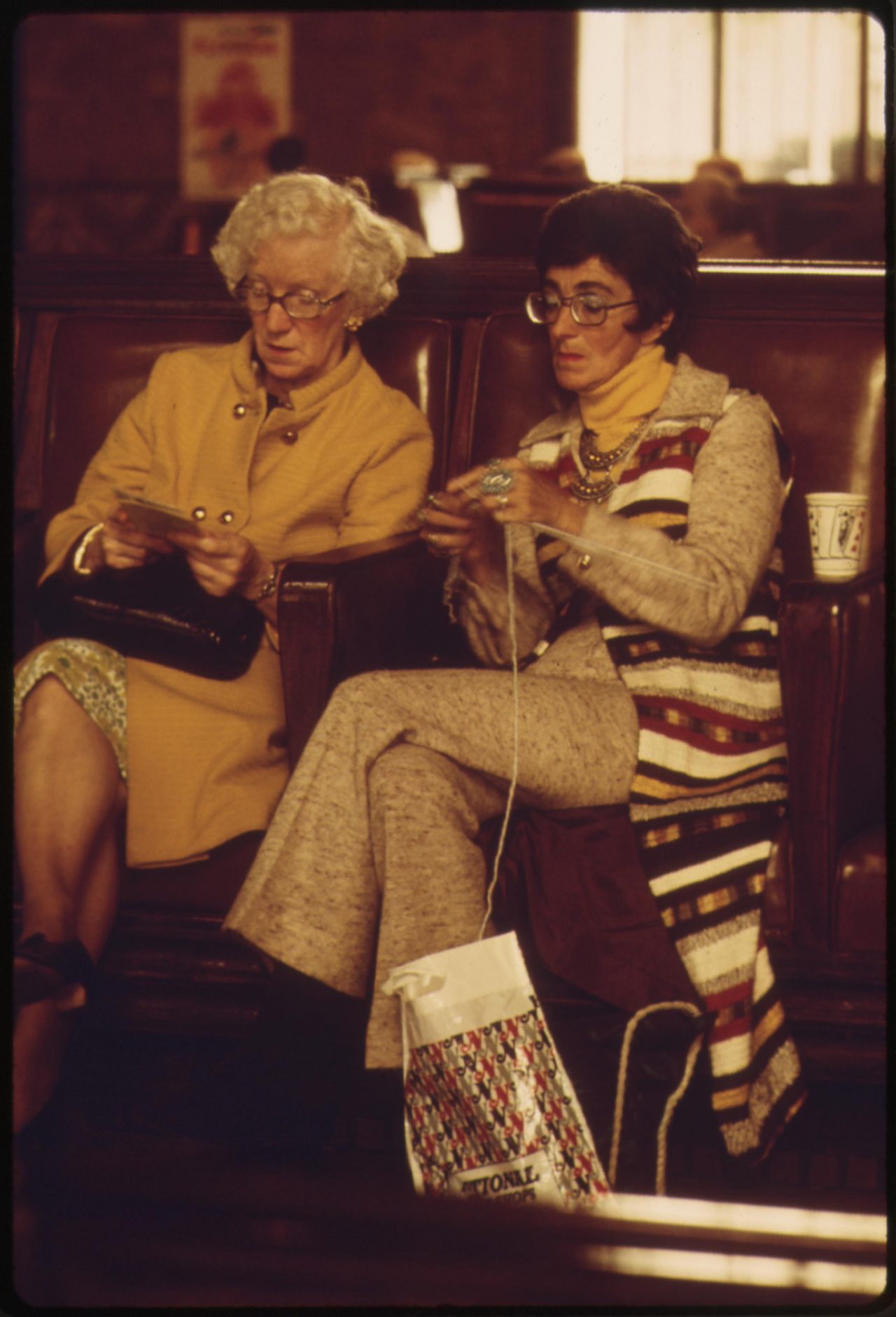 Amtrak train passengers pass the time before boarding at the Los Angeles Union Passenger Terminal, May 1974