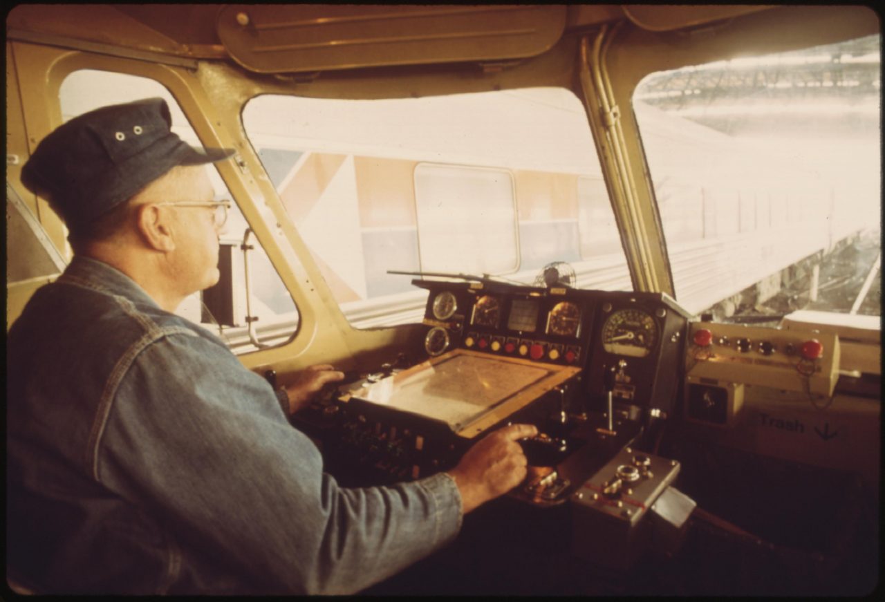 Engineer at the controls of the Amtrak turboliner passenger train at St. Louis, Missouri, June 1974