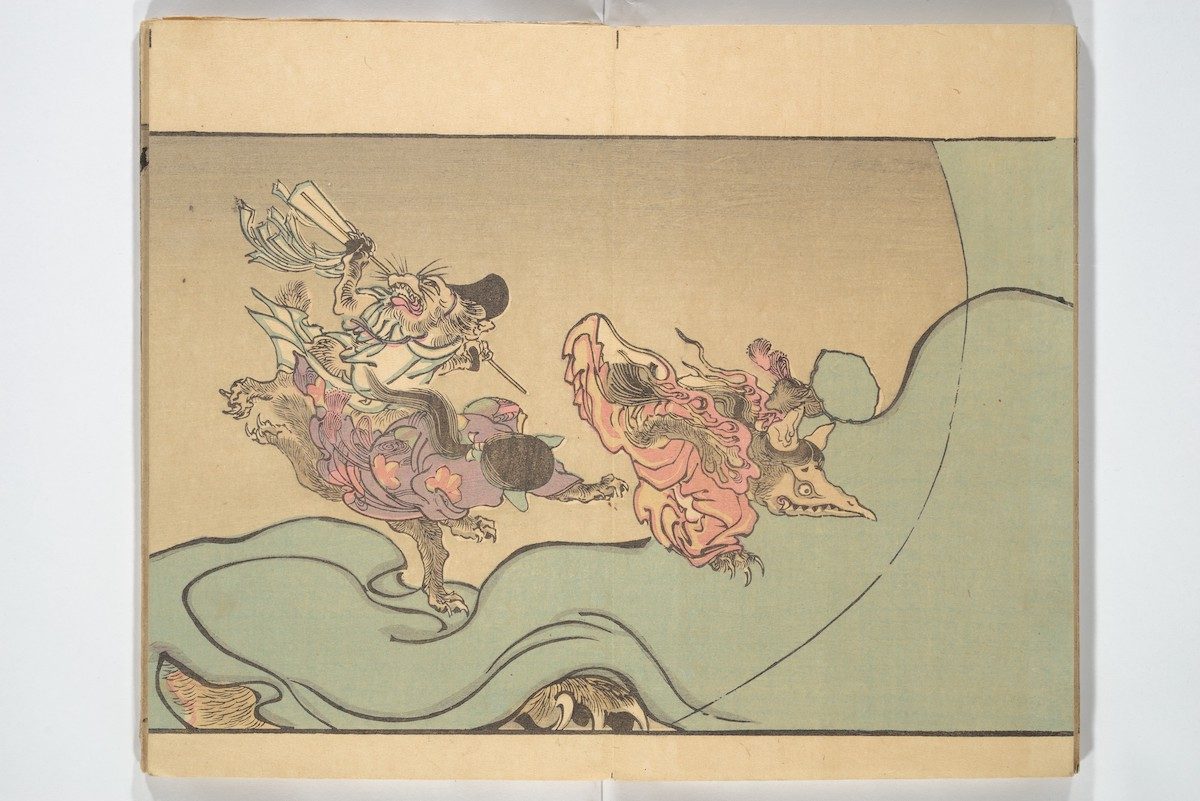 Animal demons, including one resembling a mad Shinto priest, carouse on an enormous bolt of cloth. A clawed monster hides underneath.