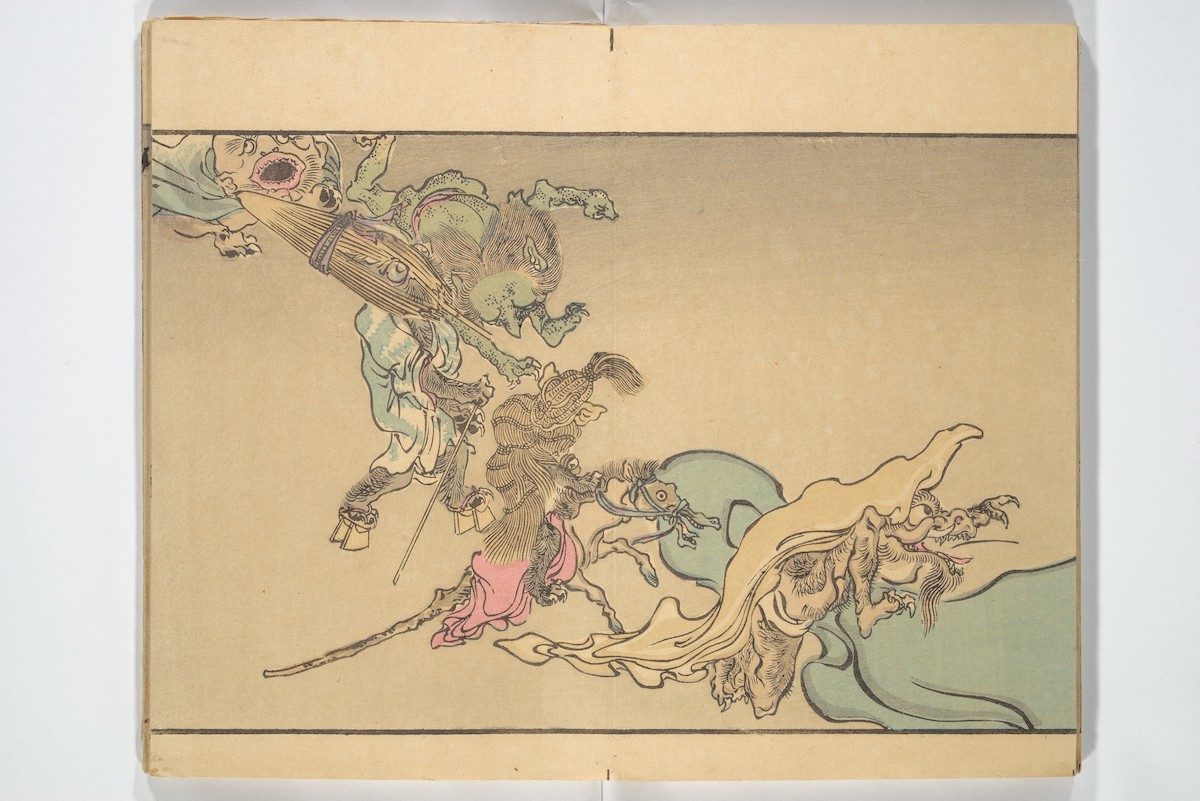 At left, a beaked demon holds an umbrella monster, followed by a rope monster riding a hobbyhorse, and a hairy monster with a long, horned snout (kirin).
