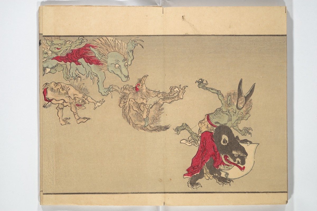 A group of rowdy ghouls appears, including, at far right, a demon in a red robe with a hand scroll.