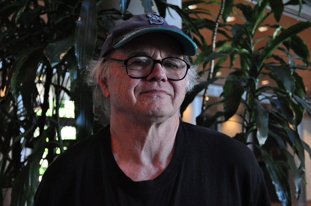 Seattle artist Gregory Blackstock, photographed in the lobby of City Hall, Seattle, Washington where a picture of his was part of an exhibition of art for Bumbershoot posters. Date 8 July 2010