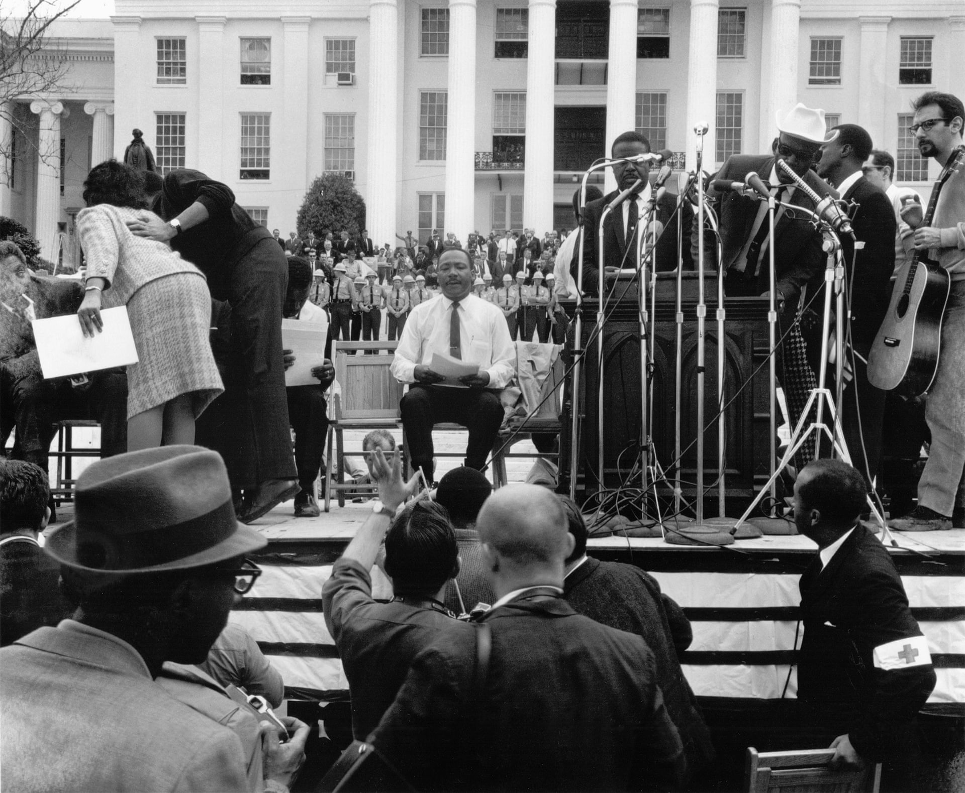Martin Luther King Jr waiting to be introduced at the Alabama Capitol after leading the 54-mile march from Selma to Montgomery, 1965
