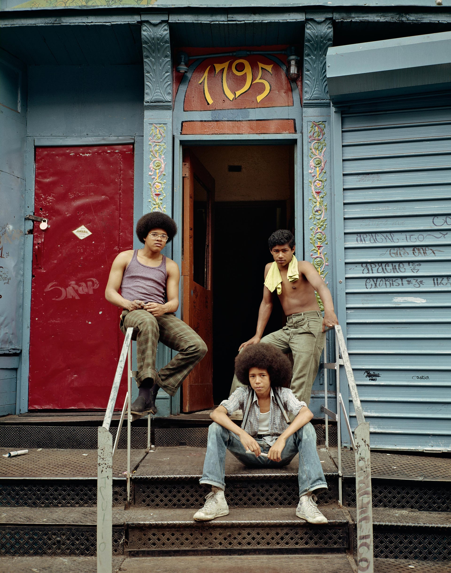 Three boys at the front door, 1975, New York 
