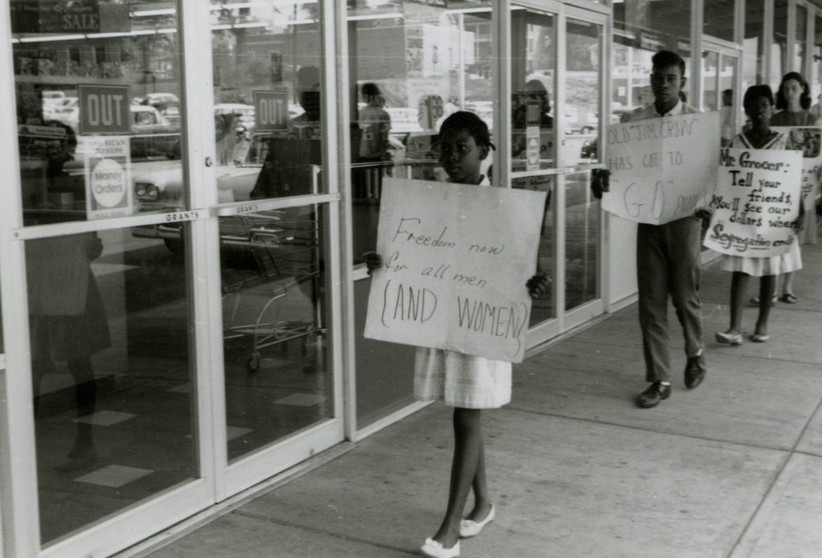 Freedom Now for all Men and Women. Protesters carry signs outside Grants store, Farmville Shopping Center, August 1963