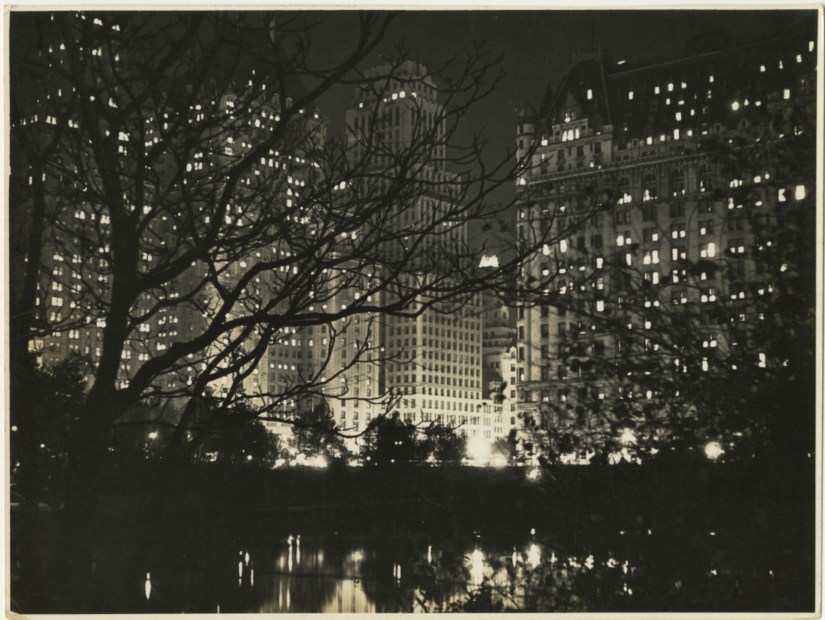 Central Park South at night on Fifth Avenue and 59th Street.