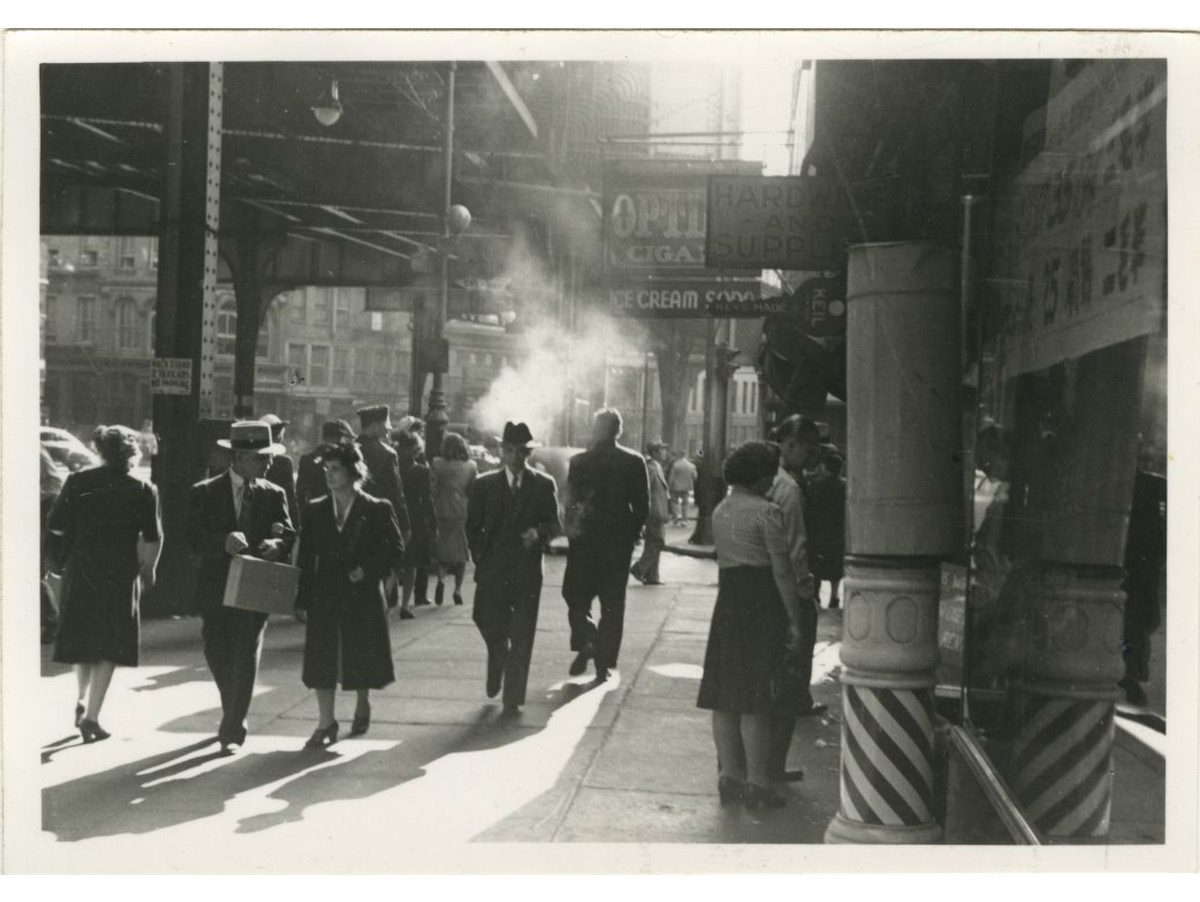 Chatham Square at the edge of Chinatown looking south on Park Row from Mott Street with Third Avenue El overhead. 1945