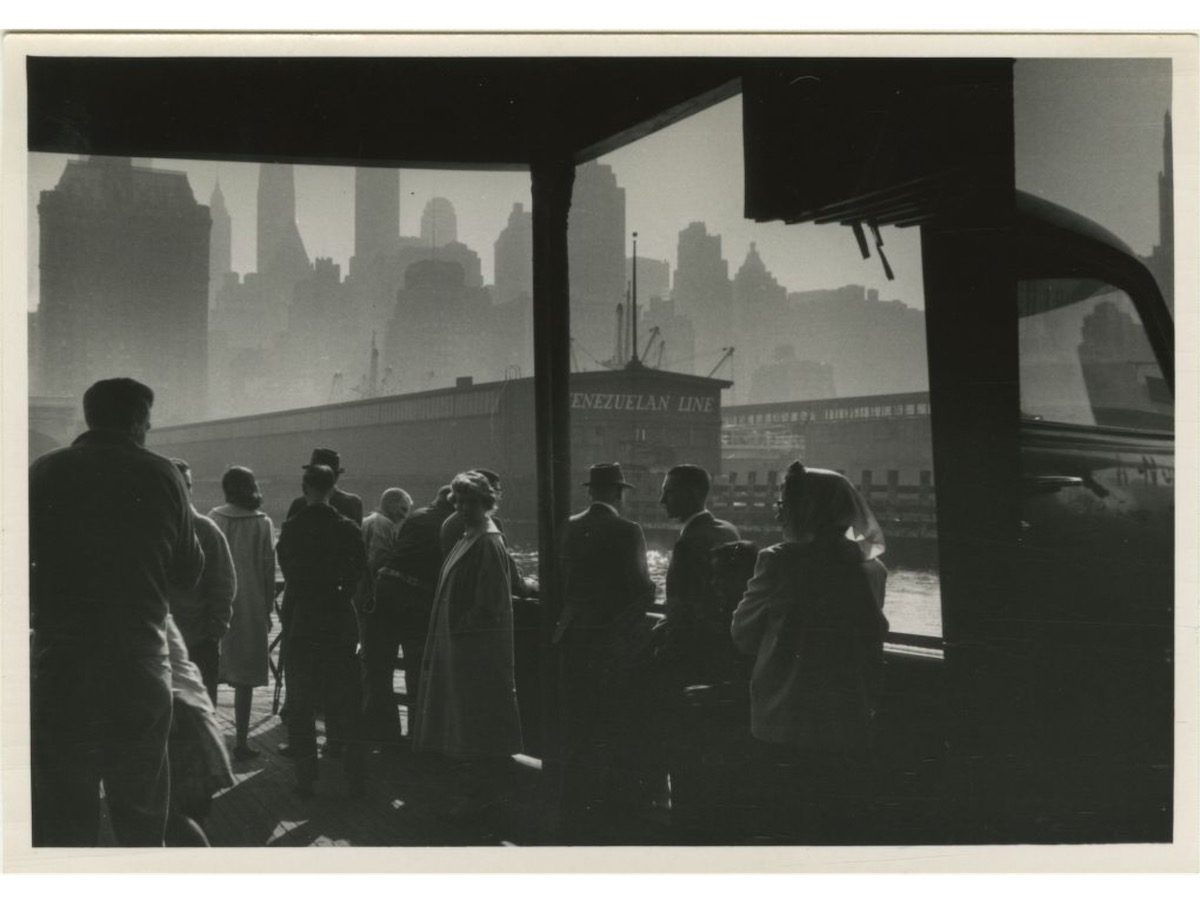 The Liberty Street Ferry approaching dock in Manhattan in the early morning 1950