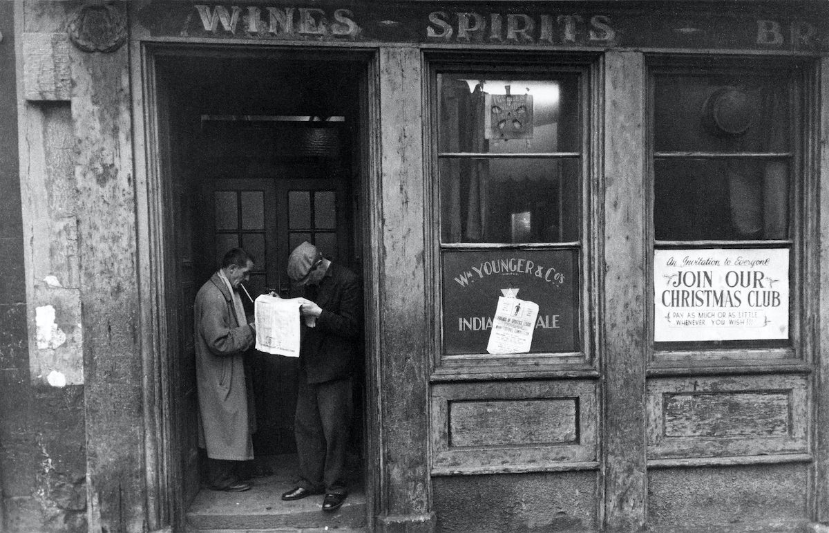 Bookmaker outside Aird’s Bar, Arthur Street, 1960
